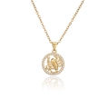 Detail of gold Scorpio pendant with relief carving and sparkling zircon border - Scorpio