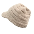 Detail shot showing the thick knit texture and brim of the cream winter hat for women - One Size / Beige