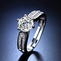 Elegant six-prong silver moissanite engagement ring with split shank on blue background - Y070【1 Carat】