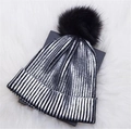 Metallic silver striped knit beanie for winter with a fluffy black faux fur pompom detail - Silver with Pom-pom