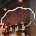 Macro detail of 15cm pearl headband with silver metal frame and wavy design - S186-3 Silver Wave Pearl