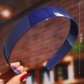 Detail view of a 13.5cm blue plastic headband held by hand for scale and size check - Blue (Simple Glossy)