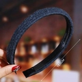 Detail view of a 15.5cm dark blue plush headband with inner non-slip grip teeth - Dark Blue (Plush)
