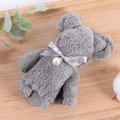 Gray coral fleece towel folded into a bear shape with a pearl bow and ribbon - Grey (30*30)