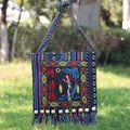 Ethnic embroidered crossbody bag with colorful tassels and traditional Ashima figure - Ashima Pattern