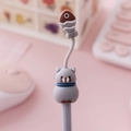 Cute gray cat gel pen with dangling brown fish charm on pink desk background - Gray Cat with Fish