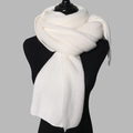 Close-up of white knitted winter scarf texture displayed on a black mannequin torso - Milk White