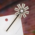 Detail of 7.2cm elegant daisy hair clip with white pearls on a black alloy base - S192-7 Pearl Daisy Linear Hair Clip