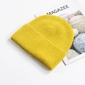 Bright yellow cuffed beanie with chunky knit texture on a clean white background - Ginger Yellow