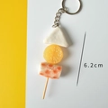 Realistic food keychain featuring fish cake and orange slices, 6.2cm pendant length - Oden Skewer