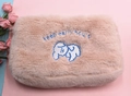 Detail of plush beige cosmetic bag with embroidered dog and keep early hours text - Khaki Dog