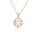 Detail of gold Libra zodiac pendant with micro-paved crystals on a delicate O-chain - Libra