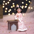 Cute traditional girl figurine in pink Hanfu leaning on a table with a chessboard - 808-11 Lady Playing Chess Style