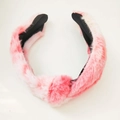 Detailed view of pink and white tie-dye plush headband with soft faux fur texture - Pink Multicolor