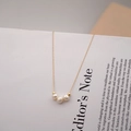 Minimalist freshwater pearl gold chain necklace featuring three pearls in a row layout - 3 Pearls Style