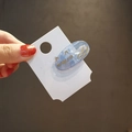 Cute translucent blue cat hair clip made of high-quality acetate on a white display card - Blue