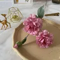Detail of pink faux peonies with flocked stems for elegant home wedding flower decor - Purple