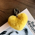 Detailed close-up of fluffy yellow heart plush keychain with elegant golden metal clasp - Yellow