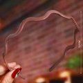 Close-up showing the 13.7CM height of a brown woven wavy pearl headband for women - Brown (Wave Glossy)