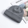 Dark grey ribbed knit beanie for men and women, stylish winter cuffed skull cap on magazine - One Size / Gray