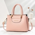 Pink litchi texture women handbag with gold hardware on minimalist display stands - L24.5xW12xH18.5cm / Pink