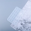 Macro detail of flexible rectangular silicone mold with 21 rune symbol crystal cavities - Runes Tablet