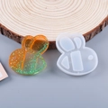 Detail of bee shaped silicone mold and gradient glitter resin pendant on wood base - Bee Shape Quicksand Mold