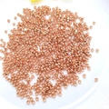 14K rose gold plated round spacer beads for DIY jewelry making scattered on white plate - 2.0mm (10g Approx 800pcs) / Rose Gold Plated (Color Retention)