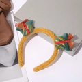 Golden plush Christmas headband featuring green gift box ornaments and red bows - Gift