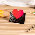 3D red heart folding greeting card with geometric patterns on a wooden desk setup - Black Heart