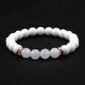 Detail of white matte stones and lavender crystal beads on a stretch bracelet - Purple & White Stone