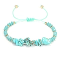 Pulsera artesanal de piedras turquesas con cordón ajustable y detalles dorados - Turquesa