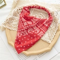 Detail of red paisley headband with elastic band on a vintage tray with lace decoration - Red