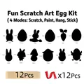 Detail-Set mit 12 Oster-Kratzbild-Eiern inkl. Holzstiften und Bändern für DIY-Bastelspaß - Oster-Kratzkarte 12er-Set (12 Eier + 12 Stifte + 12 Bänder)