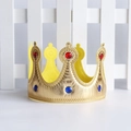 Close-up of golden fabric crown with red and blue gemstones on white grid background - One Size / Gold King Crown