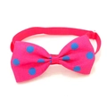 Close-up of pink pet bowtie with blue polka dots on textured grosgrain fabric - Pink Blue Polka Dot