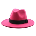 Detail of fuchsia wool fedora hat featuring a wide brim and black grosgrain ribbon band - Rose Red