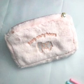 Pink plush cosmetic bag featuring 'keep early hours' embroidery and a pearl zipper - Pink Puppy