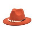 Close-up of orange wool fedora hat with black band and pearl embellishments - M (56-58cm) / Caramel color