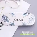 Portable hard shell glasses case with dark green banana leaf print and Natural text - Dark Green Banana Leaf