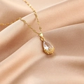 Elegant gold-plated necklace featuring a pear-cut teardrop crystal on champagne silk - Water Drop