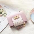 Minimalist pink and off-white short wallet for women featuring a golden leaf metal clasp - Purple