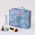Blue travel toiletry bag with pink flamingo print and sturdy top handle - Blue Flamingo
