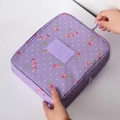 Travel cosmetic bag in purple with cherry and polka dot patterns and zipper closure - Purple Cherry