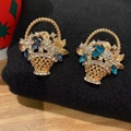 Detail of flower basket earrings with blue rhinestones on a gold alloy setting - Vintage Flower Basket Blue Gem Gold
