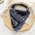 Detail of navy blue paisley elastic headband with silky texture on an elegant vintage tray - Navy Blue