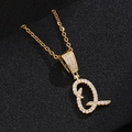 Detailed view of golden letter Q pendant featuring sparkling pavé zircons on black background - Letter Q