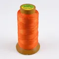 Roll of bright orange polyester cord for jewelry weaving and DIY bead stringing projects - Deep Gold
