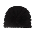 Detail of baby winter knit turban hat featuring a large black velvet bow on white background - Black