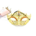 Detail shot of golden filigree masquerade mask with red rhinestones on a white background - One Size / Gold-Red Zirconia